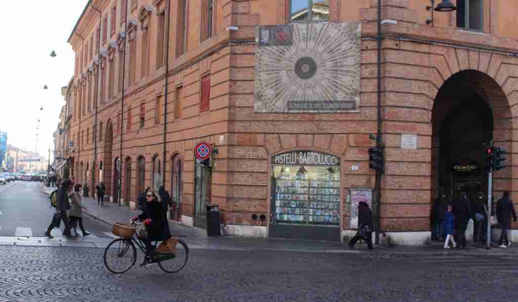 A woman bikes in Ferrara