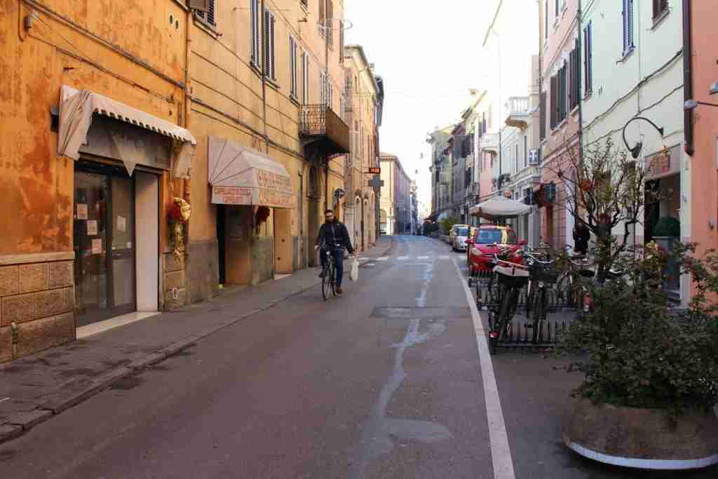 A man bikes in Ferrara