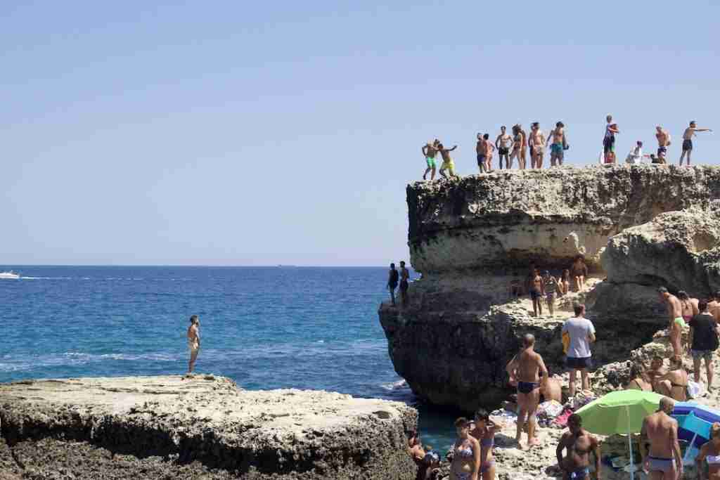 Cliff jumping at the Grotta della Poesia in Puglia