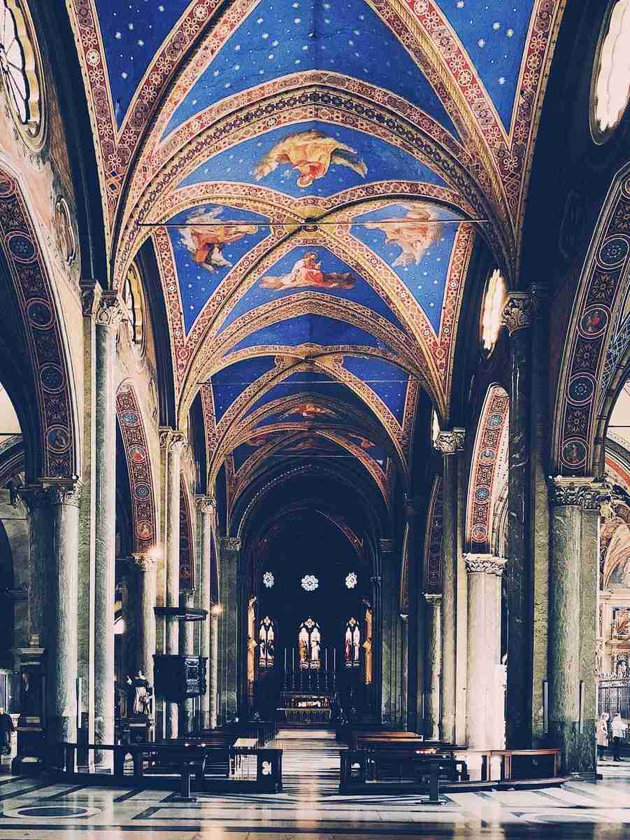 red, blue and gray interior of a church